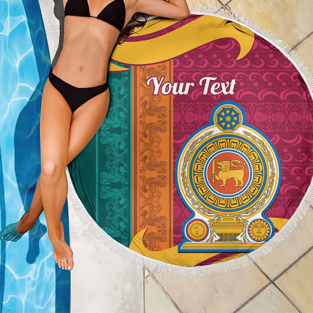 Round beach blanket with white fringe, maroon teal orange stripes and lion crest illustration