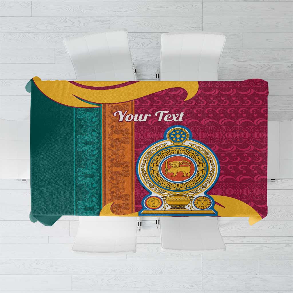 Maroon patterned tablecloth with lion crest and ornate gold, teal, and yellow swirls.