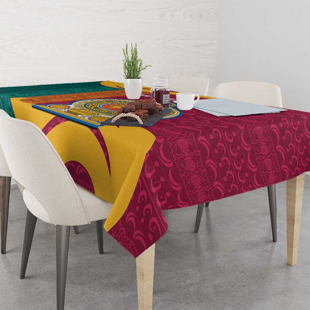 Maroon tablecloth with gold, teal, and yellow wave design and lion crest center.
