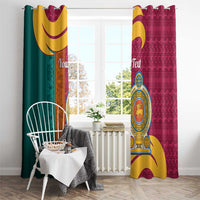 Maroon and teal window curtains with grommet tops and lion crest emblem, patterned design
