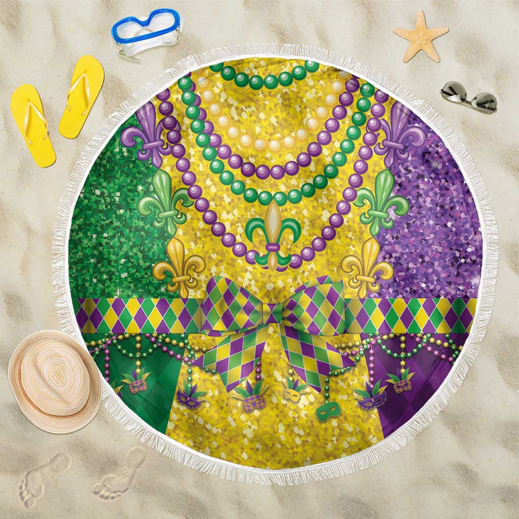 Round Mardi Gras beach blanket with colorful fleur-de-lis pattern and white fringe edge