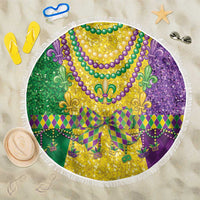 Round Mardi Gras beach blanket with colorful fleur-de-lis pattern and white fringe edge