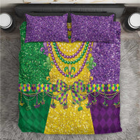 Mardi Gras bedding set with purple glitter pillows and a green, yellow, purple fleur-de-lis design