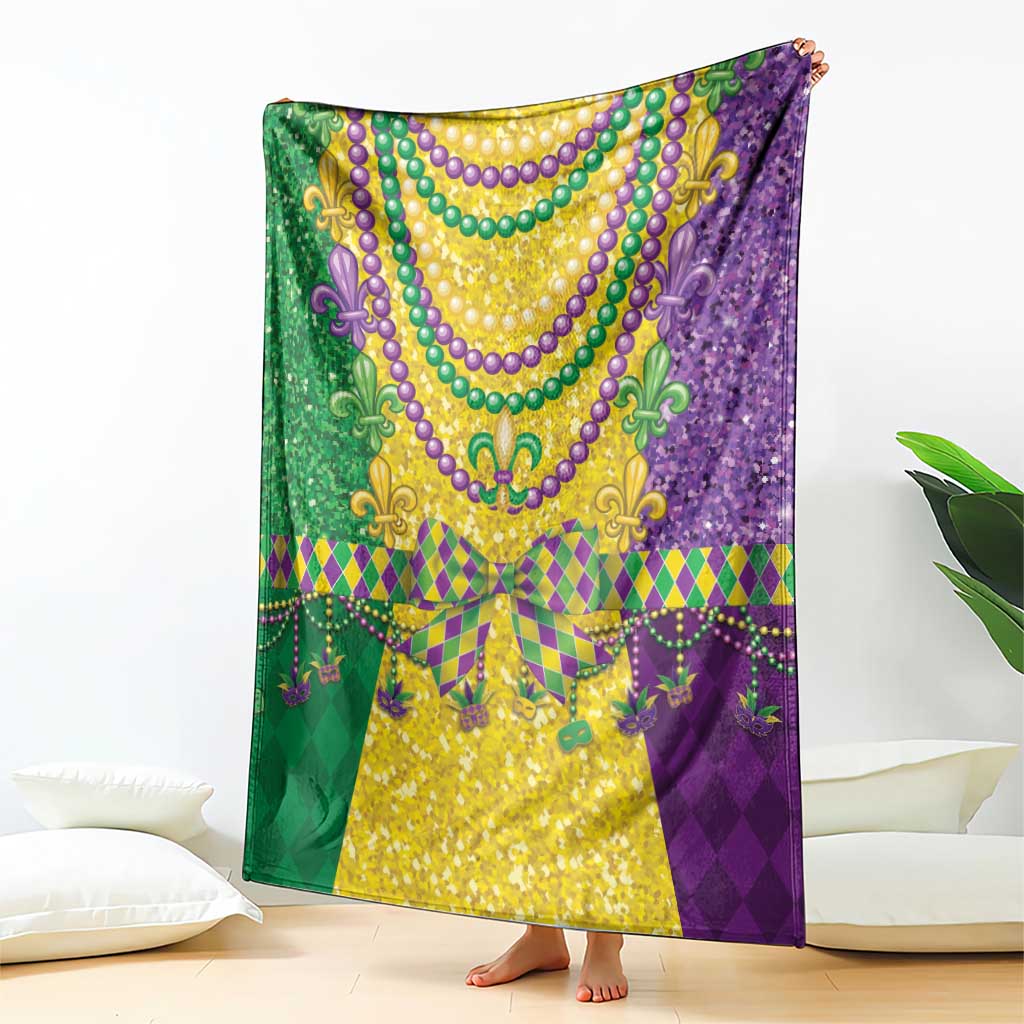 Mardi Gras blanket draped in purple and green with gold centerpiece and bead trim