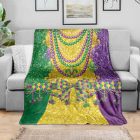 Mardi Gras throw blanket on sofa with gold center panel and purple bead necklaces
