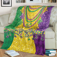 Colorful Mardi Gras blanket with fleur-de-lis ornaments, gold glitter center, and purple edge
