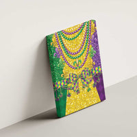 Canvas wall art with beaded fleur-de-lis necklace in green, gold, and purple