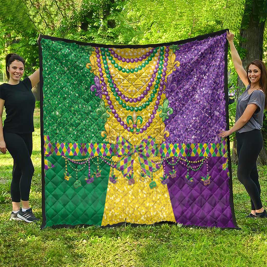 Mardi Gras fleur-de-lis quilt featuring beaded necklace design in green, yellow, purple