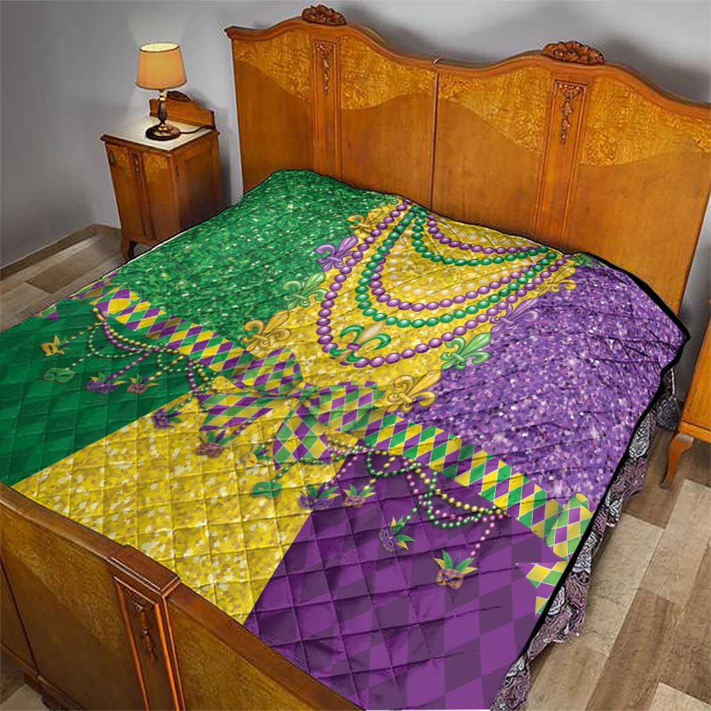 Mardi Gras fleur-de-lis quilt laid on bed, green yellow and purple beaded design