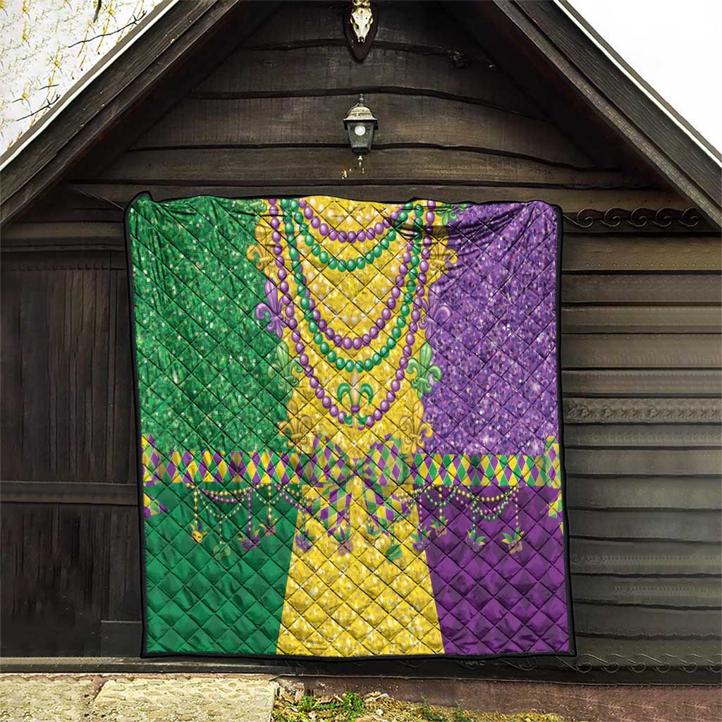Mardi Gras fleur-de-lis quilt hanging indoors, green yellow and purple beaded trim