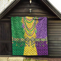 Mardi Gras fleur-de-lis quilt hanging indoors, green yellow and purple beaded trim
