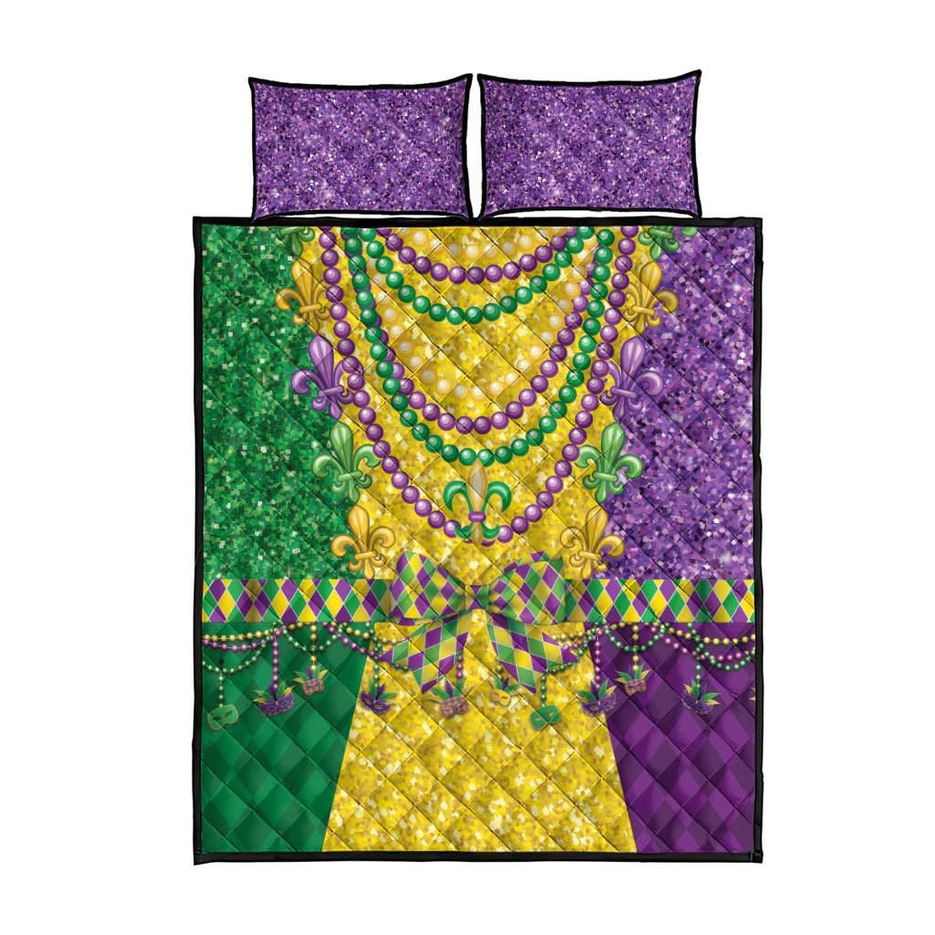 Quilt bed set with purple, green, and yellow blocks, beaded fleur-de-lis oval, two pillows