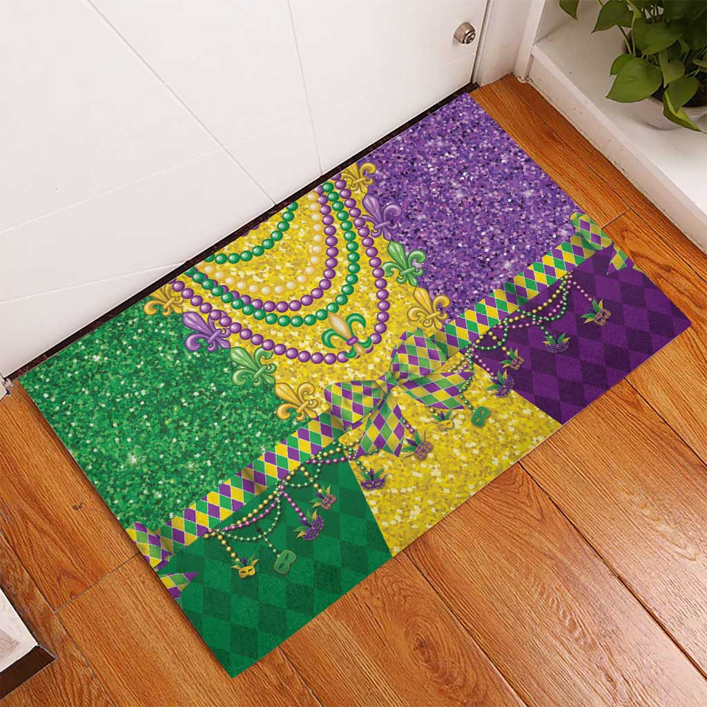 Rectangular Mardi Gras rubber doormat with gold, green, and purple fleur-de-lis bead graphic