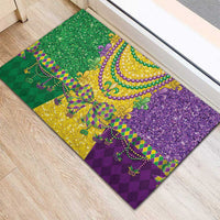 Mardi Gras rubber doormat featuring purple, green, and gold beaded necklace and fleur-de-lis