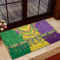 Outdoor Mardi Gras rubber doormat with green and purple glitter print and gold bead outline
