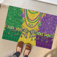 Mardi Gras rubber doormat with multicolor fleur-de-lis beaded necklace and purple glitter center