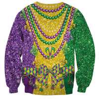 Back view crewneck sweatshirt with green purple gold bead necklace and fleur-de-lis pattern