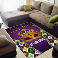 Purple Mardi Gras area rug featuring gold face mask artwork with fleur de lis accents