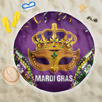 Purple Mardi Gras beach blanket with gold mask, bead accents, and white fringed edge