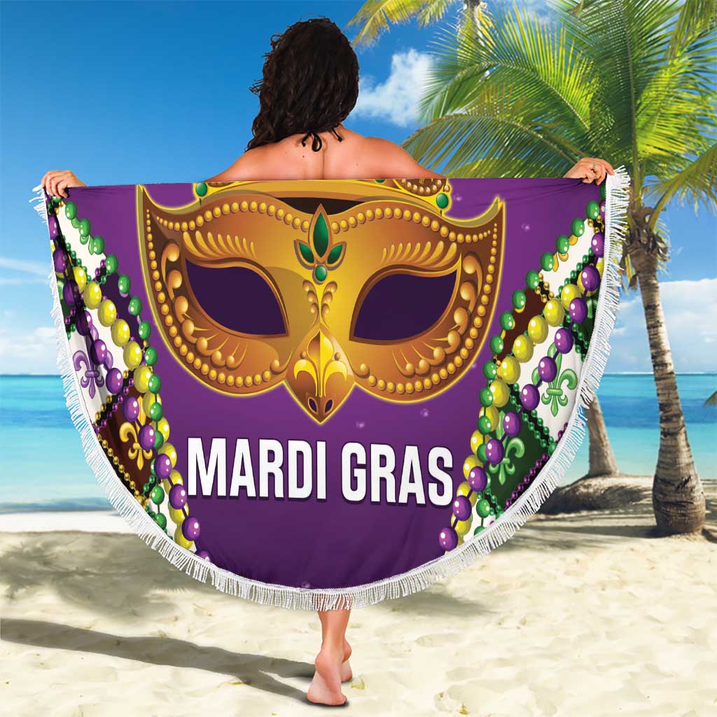 Purple Mardi Gras beach blanket held up with gold crown mask, bead border, and fringe