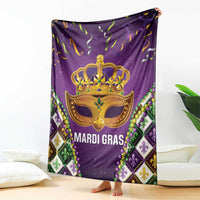 Purple Mardi Gras throw blanket featuring gold crown mask and bead trim border