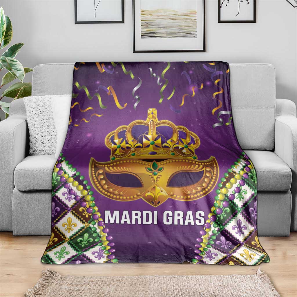 Purple Mardi Gras throw blanket with gold crown mask, MARDI GRAS text, fleur motifs