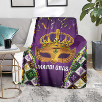 Purple Mardi Gras throw blanket with gold crown mask, bead necklace print, fleur corners
