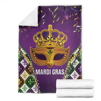 Folded purple Mardi Gras blanket with gold crown mask and MARDI GRAS lettering