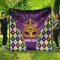 Purple Mardi Gras quilt spread outdoors, gold crown mask centerpiece and fleur-de-lis panels