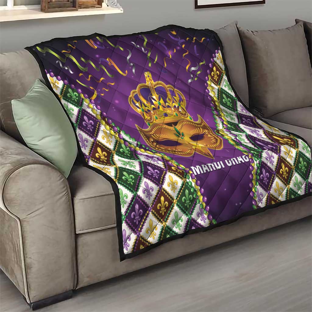Purple quilt on sofa with gold crown mask and 'MARDI GRAS' text, fleur-de-lis border