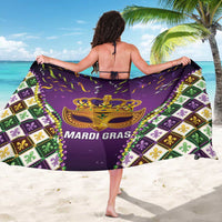 Purple Mardi Gras sarong worn as cape, gold mask and "MARDI GRAS" text center