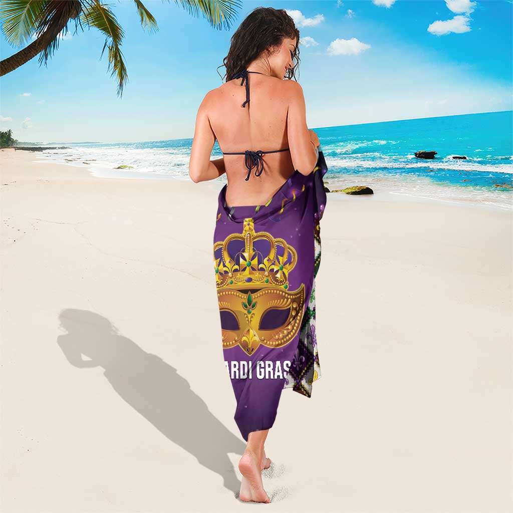 Purple Mardi Gras sarong covering legs, gold mask graphic with diamond fleur-de-lis trim