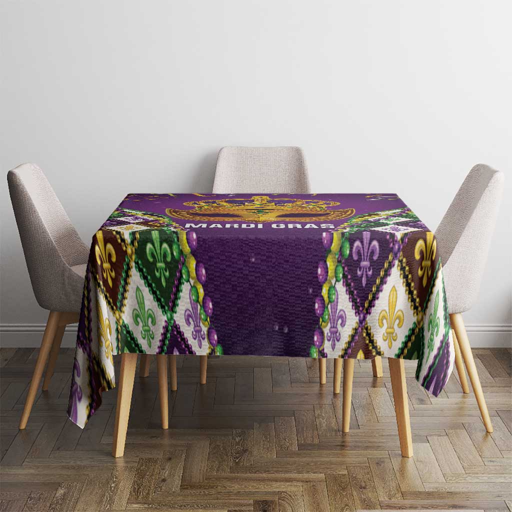 Purple tablecloth with centered gold crown graphic and multicolor diamond border
