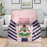Pink football blanket with diagonal navy stripes and shield crest graphic in center