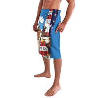 Blue printed swim shorts with eagle and kangaroo US flag artwork on side