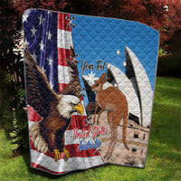 Personalized quilt draped on grass, US and Australia flags with eagle and kangaroo