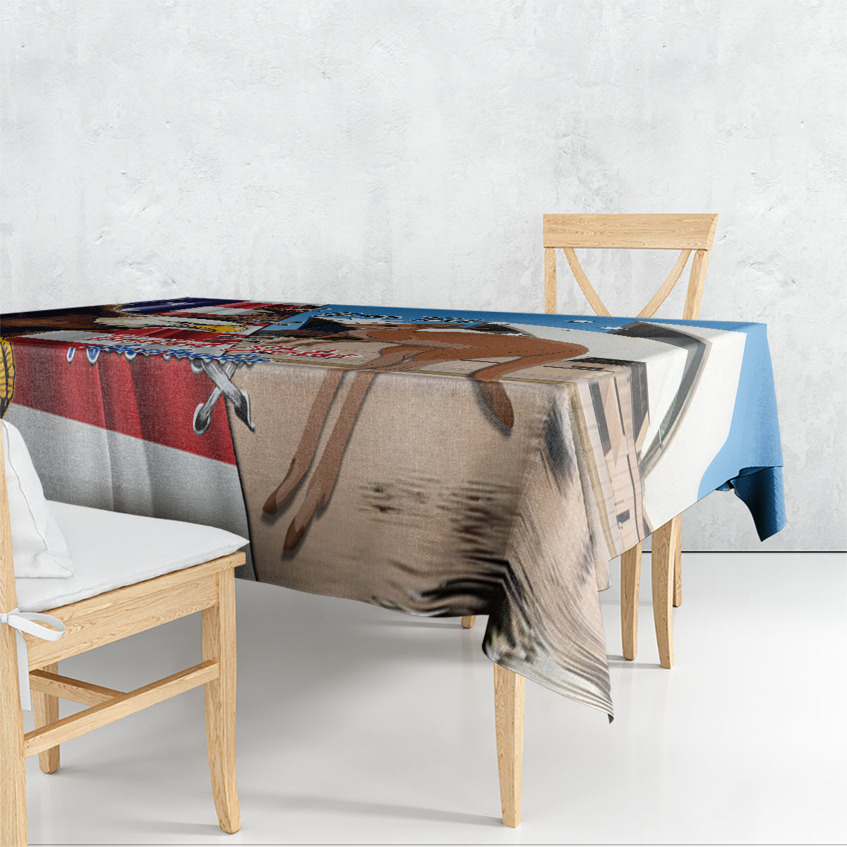 Blue tablecloth draped over table edge with eagle and kangaroo print