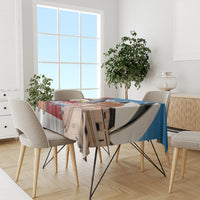 Blue tablecloth with eagle and kangaroo print across dining table