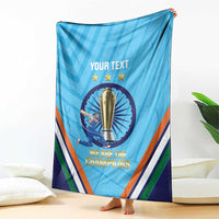 Blue cricket throw blanket with central trophy, stars, and striped border