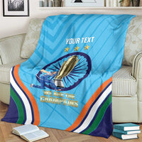 Blue cricket throw blanket with trophy graphic, stars, and bold multicolor stripes