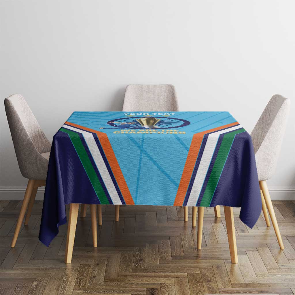Blue tablecloth on dining table with trophy emblem and multicolor stripe pattern