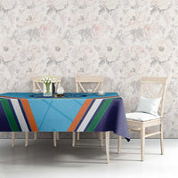 Blue sports tablecloth with trophy graphic and multicolor stripes in dining setup