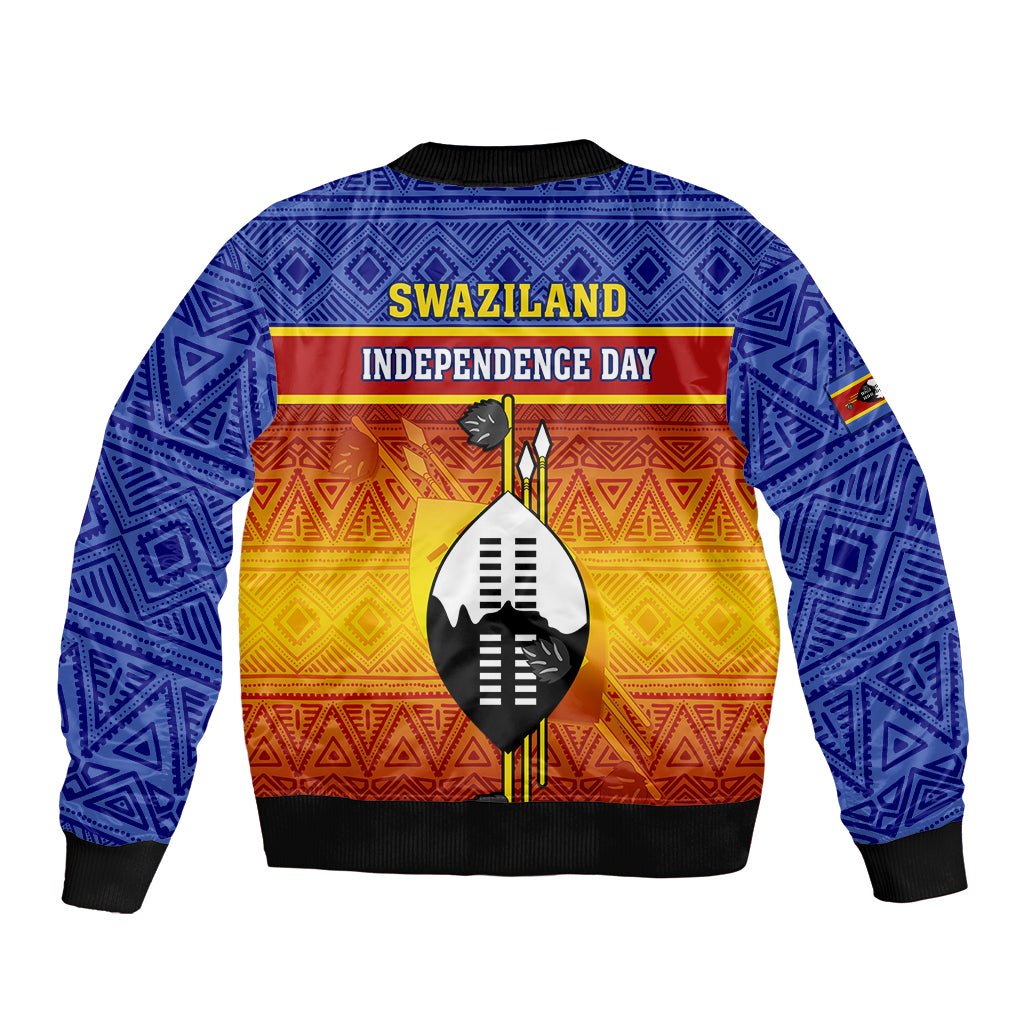 Blue bomber jacket back with Swaziland Independence Day text, shield graphic, African pattern