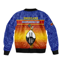 Blue bomber jacket back with Swaziland Independence Day text, shield graphic, African pattern
