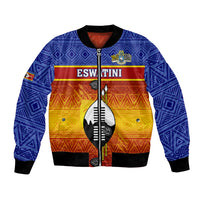 Blue bomber jacket with black trim, tribal geometric print, central shield graphic
