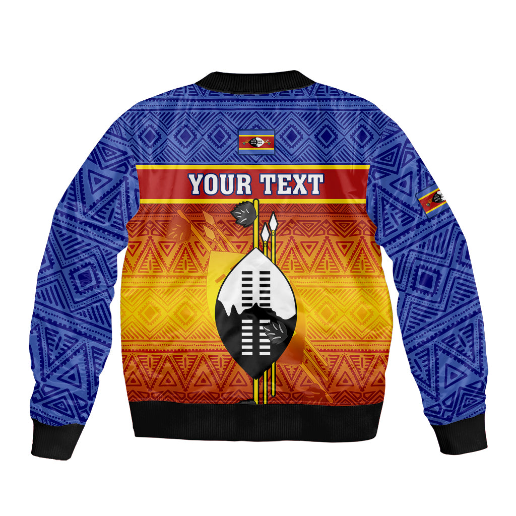 Blue bomber jacket with black trim, geometric pattern, center shield with YOUR TEXT