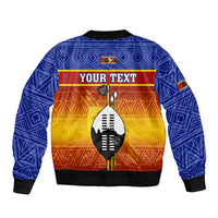 Blue bomber jacket with black trim, geometric pattern, center shield with YOUR TEXT