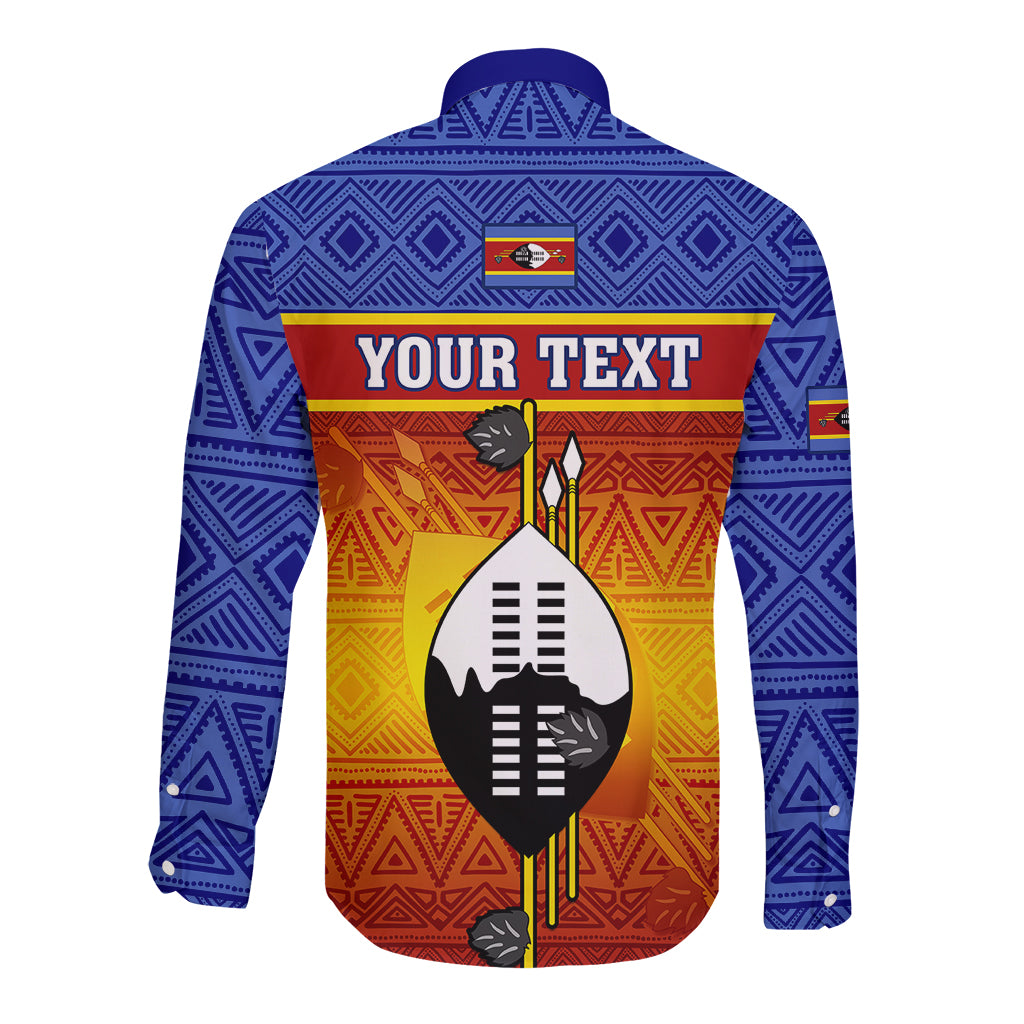 Blue long-sleeve button shirt back view with shield African pattern and 'YOUR TEXT' banner