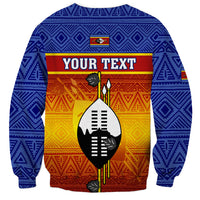 Unisex blue crewneck sweatshirt with geometric pattern and shield graphic with YOUR TEXT