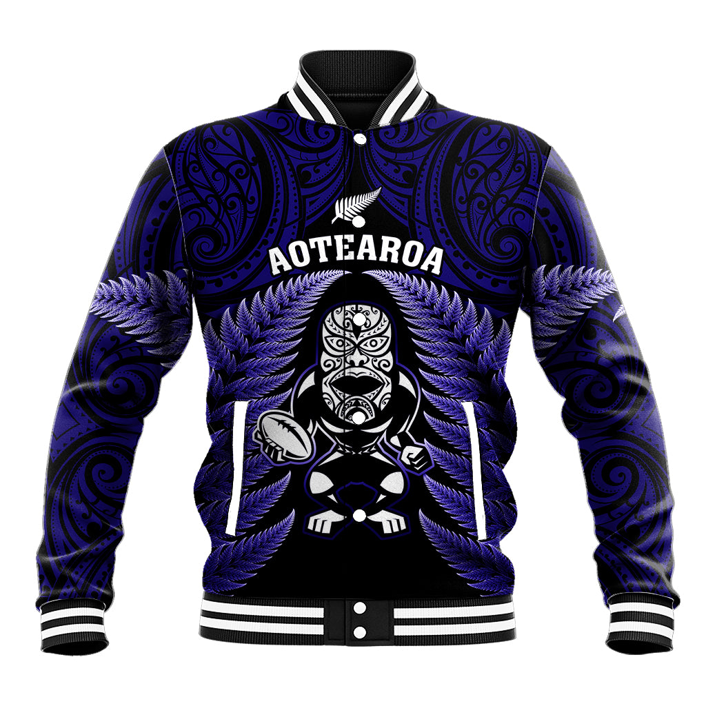 Blue rugby baseball jacket with tiki emblem and fern graphics, striped collar and cuffs